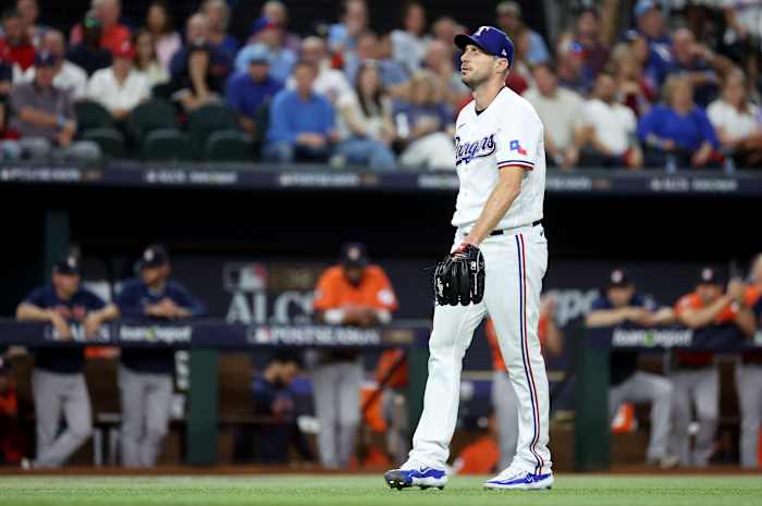 Oct 18, 2023; Arlington, Texas, USA; Texas Rangers pitcher Max Scherzer (31) reacts after a play in the first inning of game three of the ALCS against the Houston Astros in the 2023 MLB playoffs at Globe Life Field. Mandatory Credit: Kevin Jairaj-USA TODAY Sports